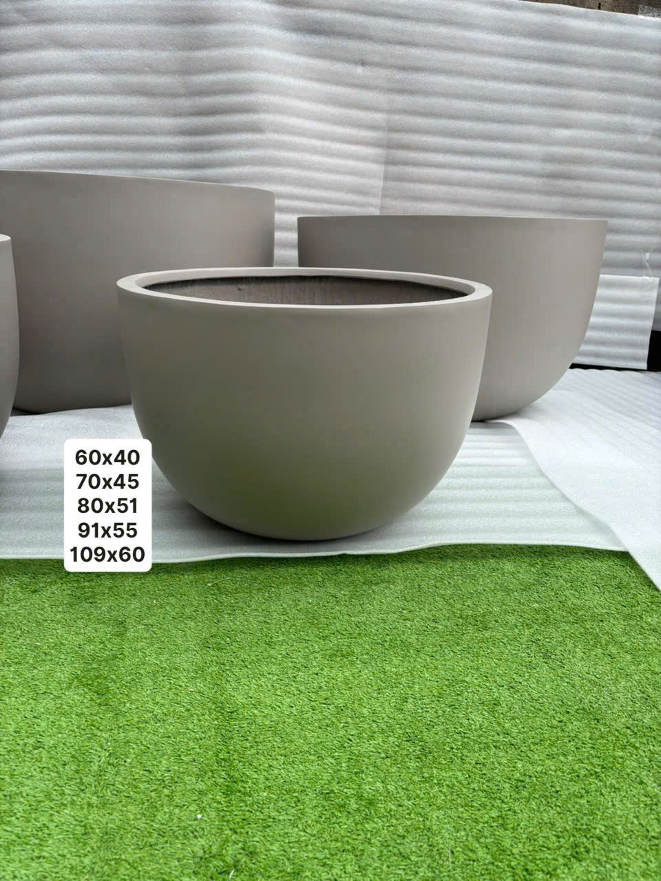 Round bowl fiberstone planters in nested sizes